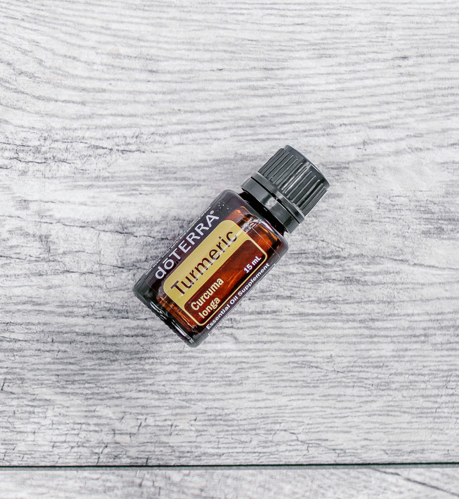 doTERRA turmeric essential oil bottle lying flat