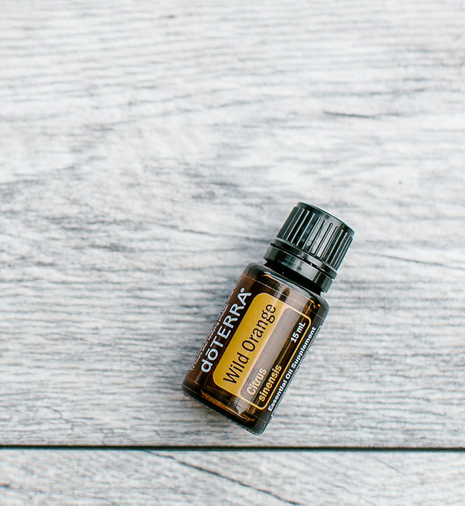 doTERRA wild orange essential oil bottle lying flat